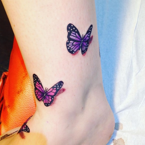 butterfly tattoo on her leg