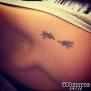 Top of the shoulder tattoo with two eyes on Christina_7