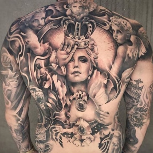 girl with a crown tattoo on his back