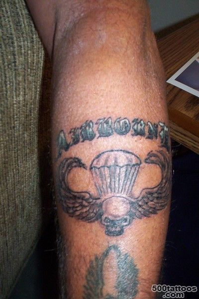 A neo-traditional airborne tattoo on the collarbone with intricate detail