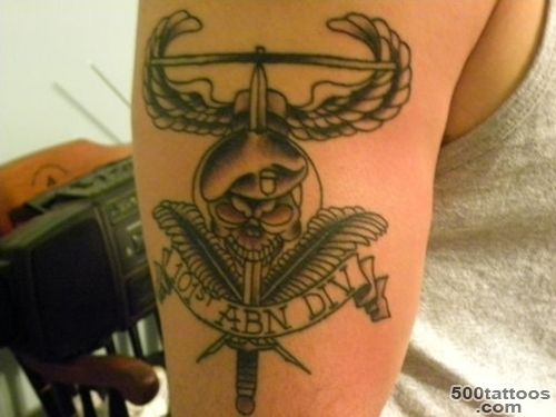 A tribal airborne tattoo on the calf with expressive detail