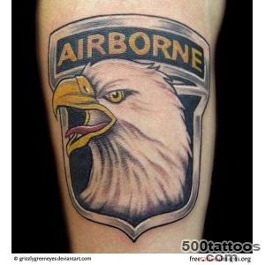 A tribal airborne tattoo on the spine with elegant detail