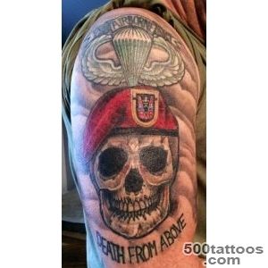 Black and grey airborne tattoo with clean linework on the forearm