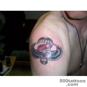 Crisp airborne tattoo in blackwork style on the upper arm