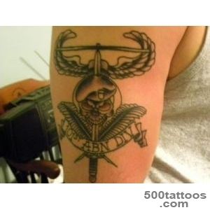 A tribal airborne tattoo on the calf with expressive detail