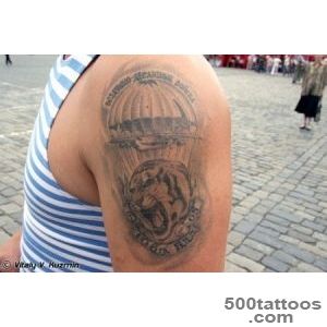 Refined airborne tattoo in watercolor style on the shoulder