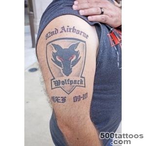 Striking fine-line airborne tattoo design on the back