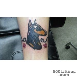 Unusual cartoon colorful doberman tattoo on arm   Tattooimagesbiz_50