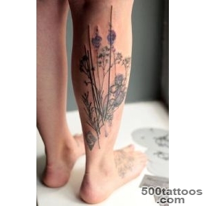 Black and grey leg tattoo with elegant linework on the spine