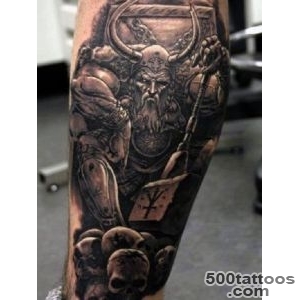 Black and grey leg tattoo with expressive linework on the calf