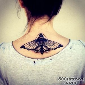 Black and white detailed mole butterfly tattoo on upper back _42