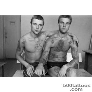 An artistic russian tattoo using minimalist technique on the thigh