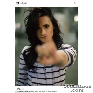 Demi Lovato shows off her latest body art a smiley face tattoo _37