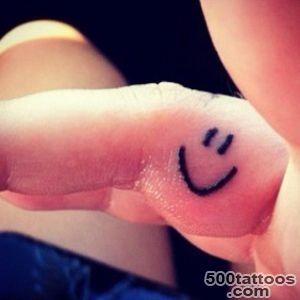 smiley face tattoo on the inside of my right ring finger! )  tat _18
