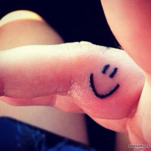 smiley face tattoo on the inside of my right ring finger! )  tat ..._18