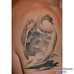 Cool tribal double black ink swans tattoo on wrist   Tattooimagesbiz_23
