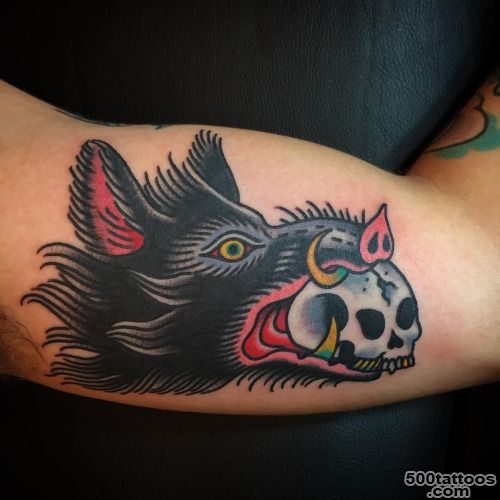 Skull On Boar Mouth Tattoo On Bicep_37