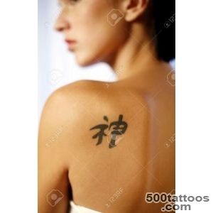 Woman With A Chinese Character Tattoo On Her Back Stock Photo _23