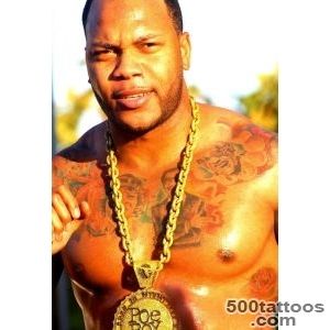 Rapper Flo Rida showing the tattoos on his chest and ribs _21
