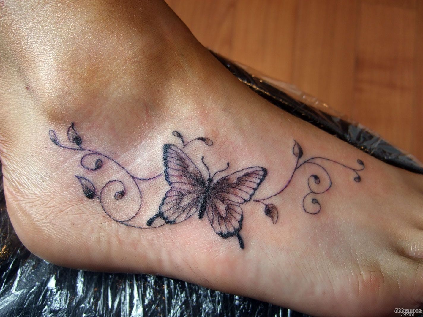 Small butterfly men tattoos on foot_35