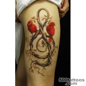 Awesome red birds and treble clef tattoo on thigh   Tattooimagesbiz_32